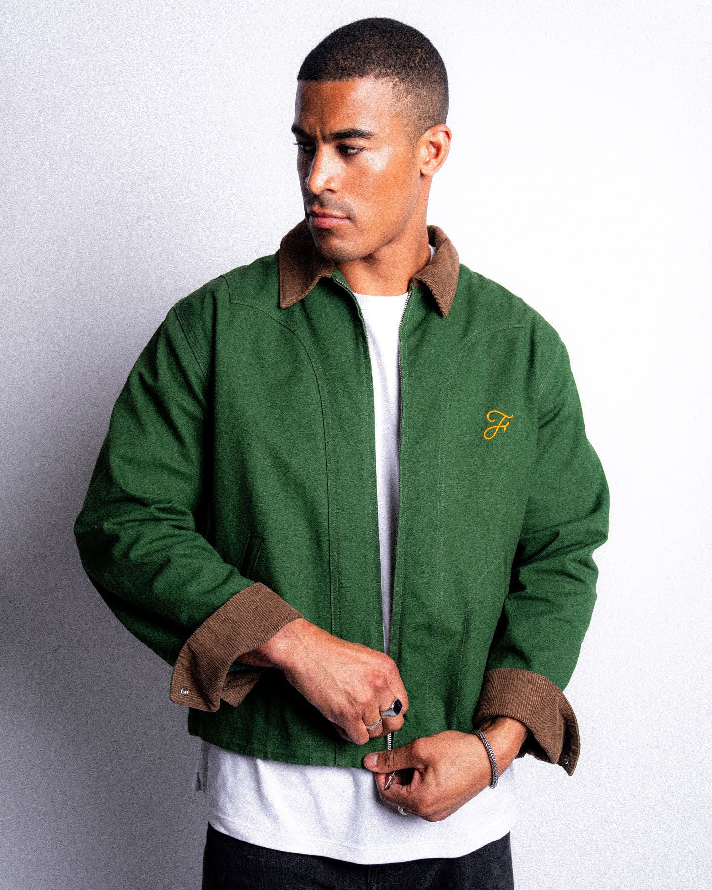 Bandit Jacket by Fades green zip-up jacket with corduroy collar worn by model