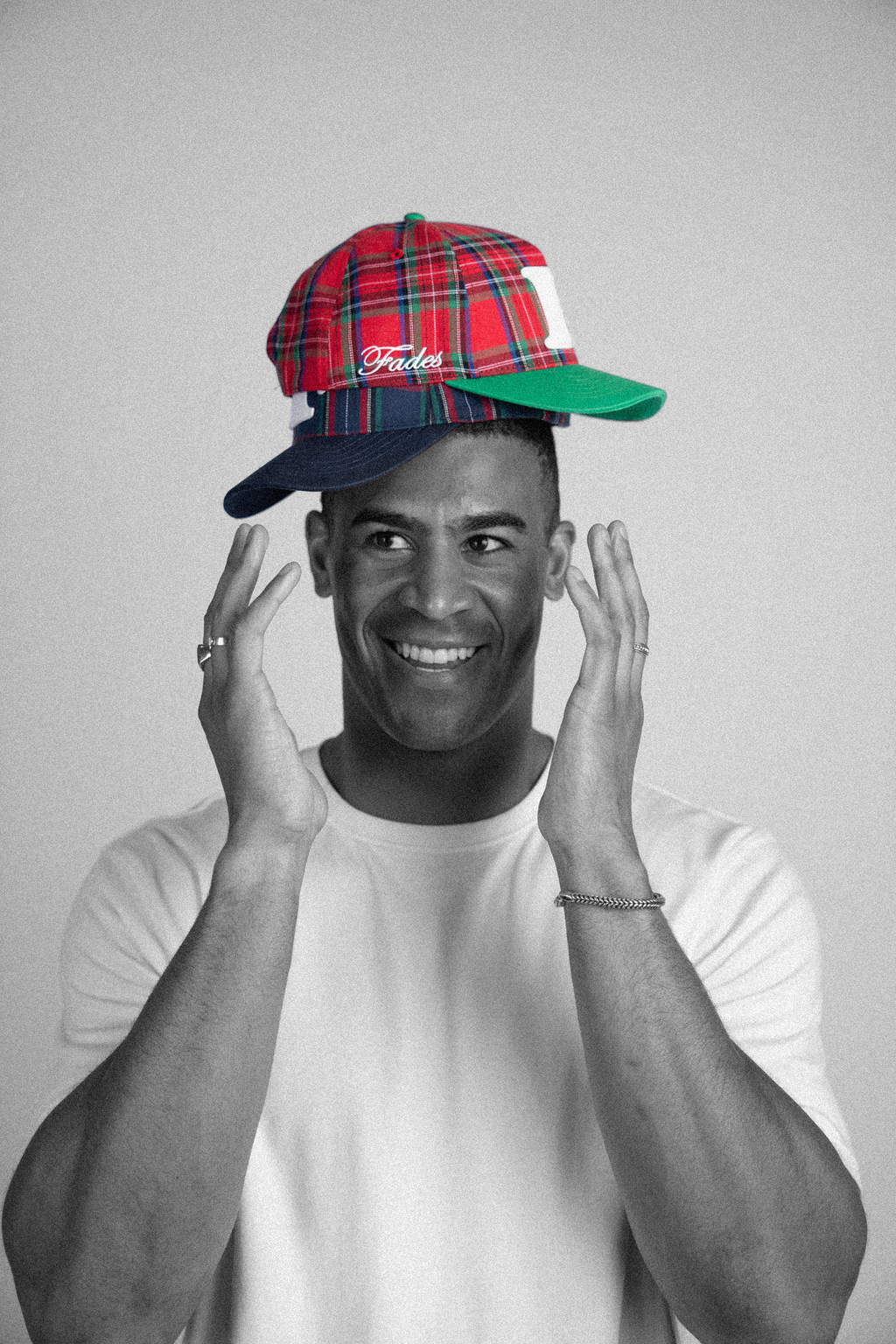 Plaid “F” Snapback by Fades red and green plaid snapback hat worn by model
